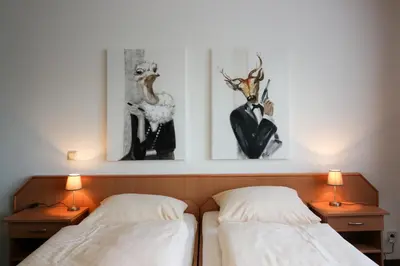 Ein Bett oder Betten in einem Zimmer der Unterkunft HARZ HOTEL und Gästehaus am Bornweg