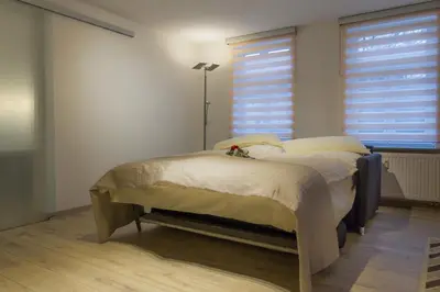 Ein Bett oder Betten in einem Zimmer der Unterkunft Ferienwohnung am Schlosspark