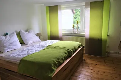 Ein Bett oder Betten in einem Zimmer der Unterkunft Ursprüngliches Harzhaus für Aktive in Clausthal