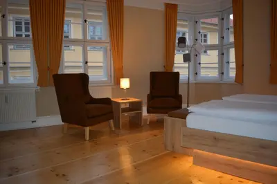 Ein Bett oder Betten in einem Zimmer der Unterkunft Kunsthaus mit Frühstück im Hotel Theophano
