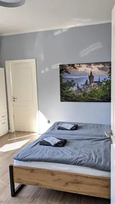 Ein Bett oder Betten in einem Zimmer der Unterkunft Goethes liebste Betten - stilvolle Ferienwohnungen im historischen Fachwerkhaus in Wernigerode - Parkplatz, Smart-TV, W-Lan