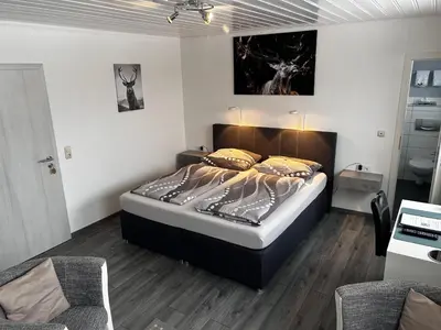 Ein Bett oder Betten in einem Zimmer der Unterkunft Hotel Brunnenbach