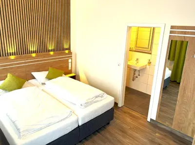 Ein Bett oder Betten in einem Zimmer der Unterkunft Berghotel Glockenberg
