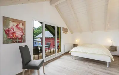 Ein Bett oder Betten in einem Zimmer der Unterkunft Ferienhausdorf Thale
