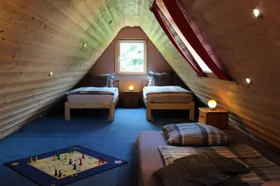 Ein Bett oder Betten in einem Zimmer der Unterkunft Ferienwohnung Villa am Golfplatz