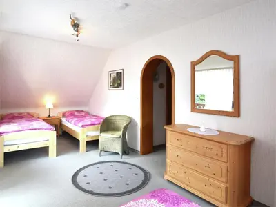 Ein Bett oder Betten in einem Zimmer der Unterkunft Gruppen- Ferienhaus in Wieda