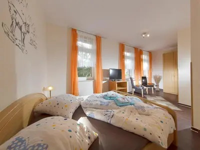 Ein Bett oder Betten in einem Zimmer der Unterkunft Hasseröder Hof