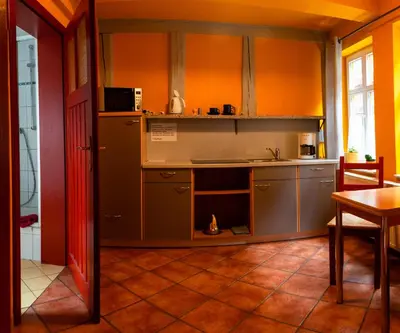 Küche/Küchenzeile in der Unterkunft Fachwerkhotel garni - Ferienhäuser Vorhof zur Hölle
