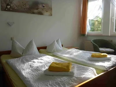 Ein Bett oder Betten in einem Zimmer der Unterkunft Pension Schmidt