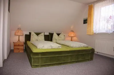 Ein Bett oder Betten in einem Zimmer der Unterkunft Harz-Sonne