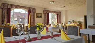 Ein Restaurant oder anderes Speiselokal in der Unterkunft Hotel Blocksberg