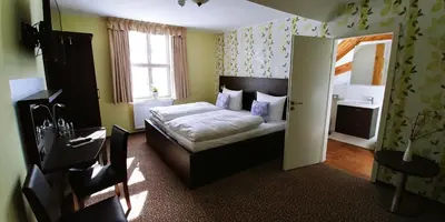 Ein Bett oder Betten in einem Zimmer der Unterkunft Hotel Alte Brennerei
