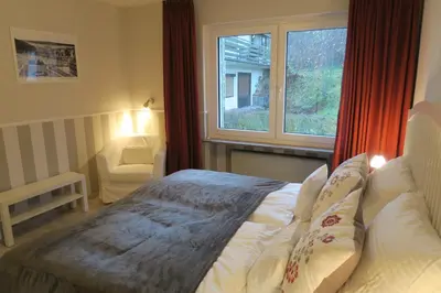 Ein Bett oder Betten in einem Zimmer der Unterkunft Harzgenuß