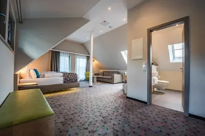 Ein Bett oder Betten in einem Zimmer der Unterkunft AKZENT Hotel Villa Saxer