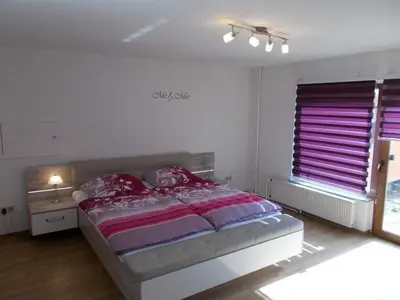 Ein Bett oder Betten in einem Zimmer der Unterkunft Janos Ferienwohnung