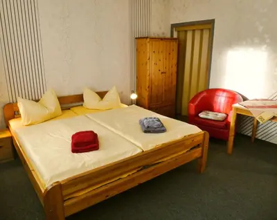 Ein Bett oder Betten in einem Zimmer der Unterkunft Pension Haus Rodenstein