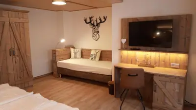 Ein Bett oder Betten in einem Zimmer der Unterkunft Gasthaus Brockenhėxe mit Restaurant & Café