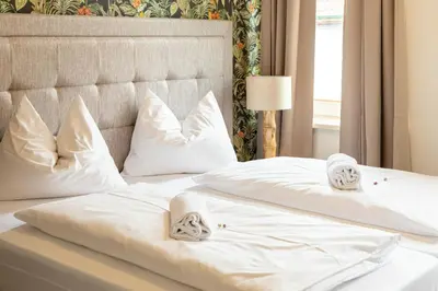 Ein Bett oder Betten in einem Zimmer der Unterkunft Hotel Kaiserhof