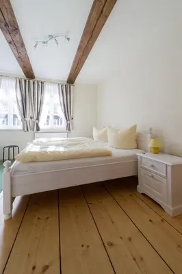Ein Bett oder Betten in einem Zimmer der Unterkunft Ferienwohnungen am Klint