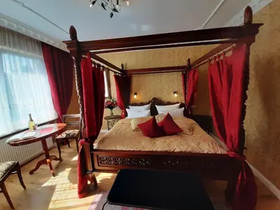 Ein Bett oder Betten in einem Zimmer der Unterkunft Stadtparkhotel Alexandra