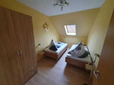 Ein Bett oder Betten in einem Zimmer der Unterkunft Ferienwohnung-Thale-Ritter