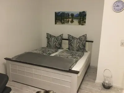 Ein Bett oder Betten in einem Zimmer der Unterkunft Ferienwohnung Univers