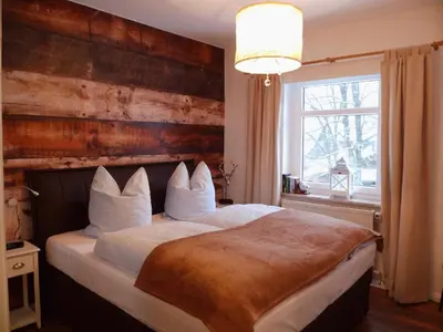 Ein Bett oder Betten in einem Zimmer der Unterkunft Harzglück