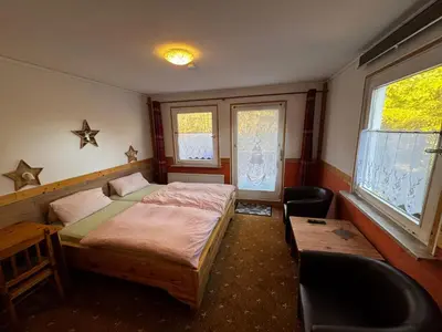 Ein Bett oder Betten in einem Zimmer der Unterkunft Wald-Landhaus