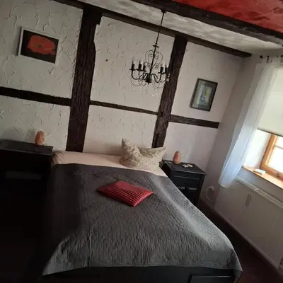 Ein Bett oder Betten in einem Zimmer der Unterkunft Kleine Auszeit am Rathaus