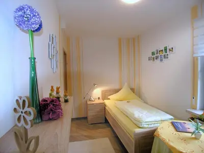 Ein Bett oder Betten in einem Zimmer der Unterkunft Ferienwohnung Traumblick