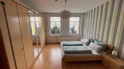 Ein Bett oder Betten in einem Zimmer der Unterkunft Ferienwohnung am Bodetal mit Wallbox für E-Auto
