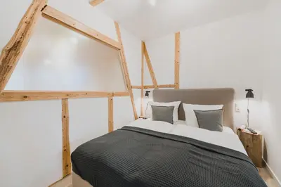 Ein Bett oder Betten in einem Zimmer der Unterkunft HarzLodge Emma