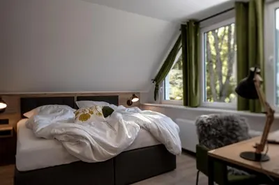 Ein Bett oder Betten in einem Zimmer der Unterkunft Berg und Tal Hotel & Apartments