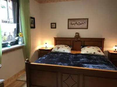 Ein Bett oder Betten in einem Zimmer der Unterkunft Ferienwohnung Willgeroth