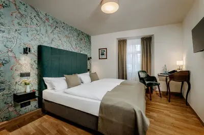 Ein Bett oder Betten in einem Zimmer der Unterkunft Romantik Hotel Alte Münze