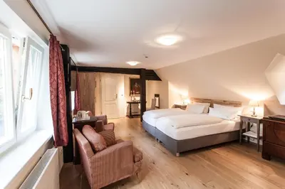 Ein Bett oder Betten in einem Zimmer der Unterkunft Romantik Hotel Alte Münze