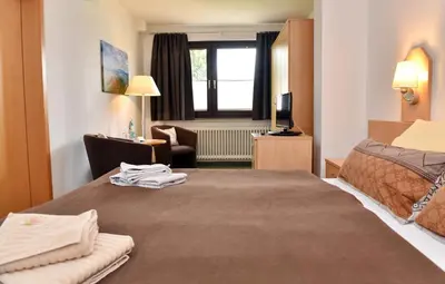 Ein Bett oder Betten in einem Zimmer der Unterkunft Pension - Der Berghof
