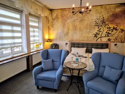 Ein Sitzbereich in der Unterkunft Altstadt Pension Orchidee