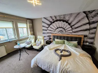 Ein Bett oder Betten in einem Zimmer der Unterkunft Altstadt Pension Orchidee