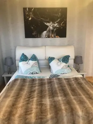 Ein Bett oder Betten in einem Zimmer der Unterkunft FEWO Am Eichenberg
