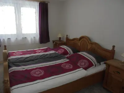 Ein Bett oder Betten in einem Zimmer der Unterkunft Bergfreiheit