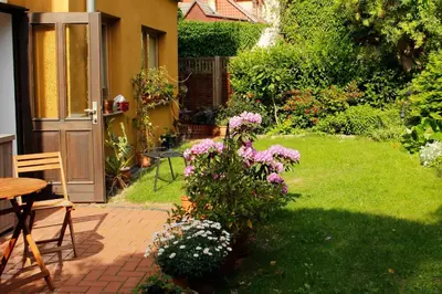 Ein Garten an der Unterkunft Ferienwohnungen-Stobenstraße-de