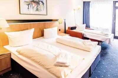 Ein Bett oder Betten in einem Zimmer der Unterkunft Apartment Seeblick am Bocksberg - Hahnenklee 
