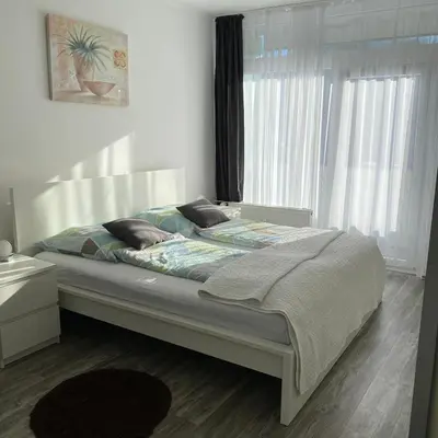 Ein Bett oder Betten in einem Zimmer der Unterkunft International