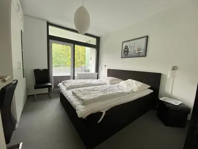 Ein Bett oder Betten in einem Zimmer der Unterkunft De Luchs