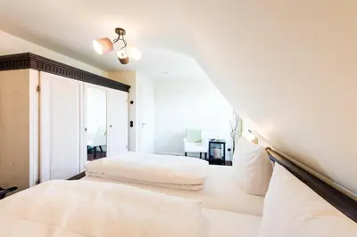 Ein Bett oder Betten in einem Zimmer der Unterkunft Zum fröhlichen Tagelöhner