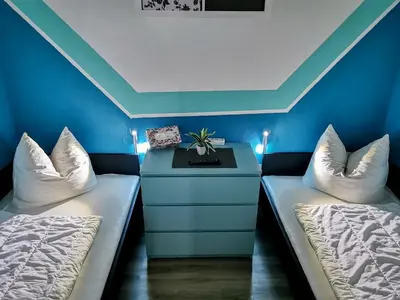 Ein Bett oder Betten in einem Zimmer der Unterkunft Hahnenklee Ferienpark 7-511