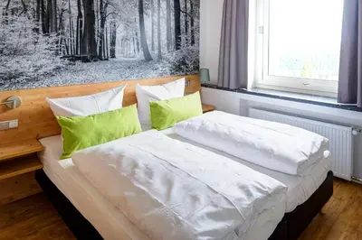 Ein Bett oder Betten in einem Zimmer der Unterkunft BSW Ferienwohnungen Brockenblick