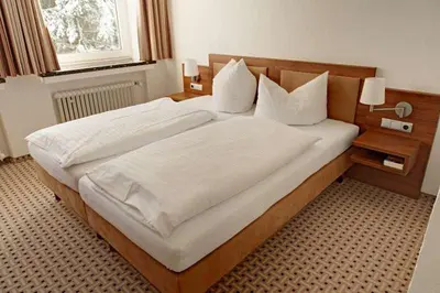 Ein Bett oder Betten in einem Zimmer der Unterkunft BSW Ferienwohnungen Brockenblick