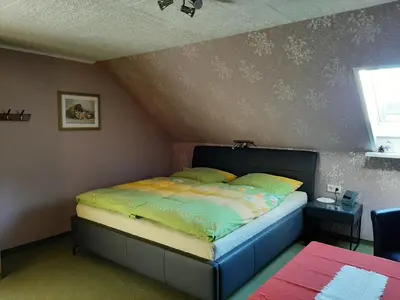 Ein Bett oder Betten in einem Zimmer der Unterkunft Ferienzimmer Wenzel